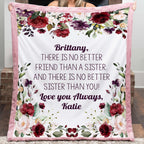Person holding a floral blanket with personalized text