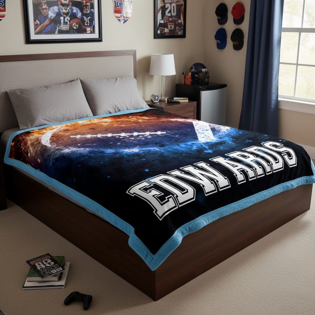 Bedroom with a bed featuring a 'Edwards' blanket and sports memorabilia on the wall.
