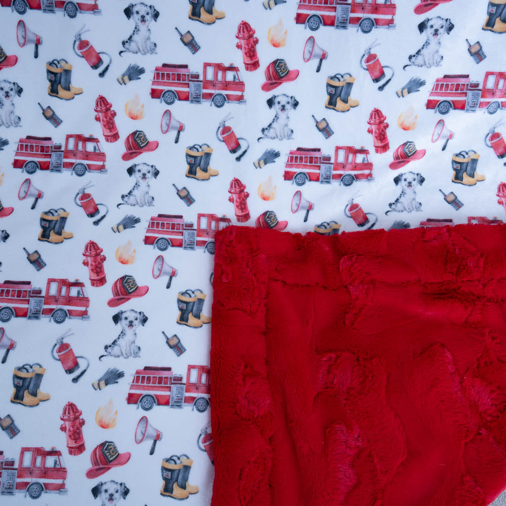 Fire truck, dog, and other fire-related items on a white background with a red fabric swatch.