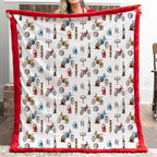 Person holding a blanket with motorcycle pattern and red border