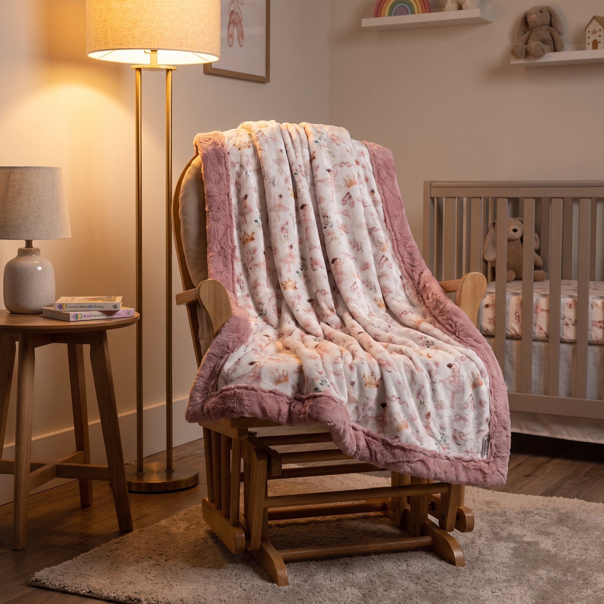 Soft pink floral baby blanket draped over a nursery rocking chair