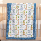 A personalized baby blanket with a blue faux fur trim, featuring a white center printed with watercolor-style giraffes, elephants, lions, and the name 'HAYDEN John' in blue, draped over a wooden crib.