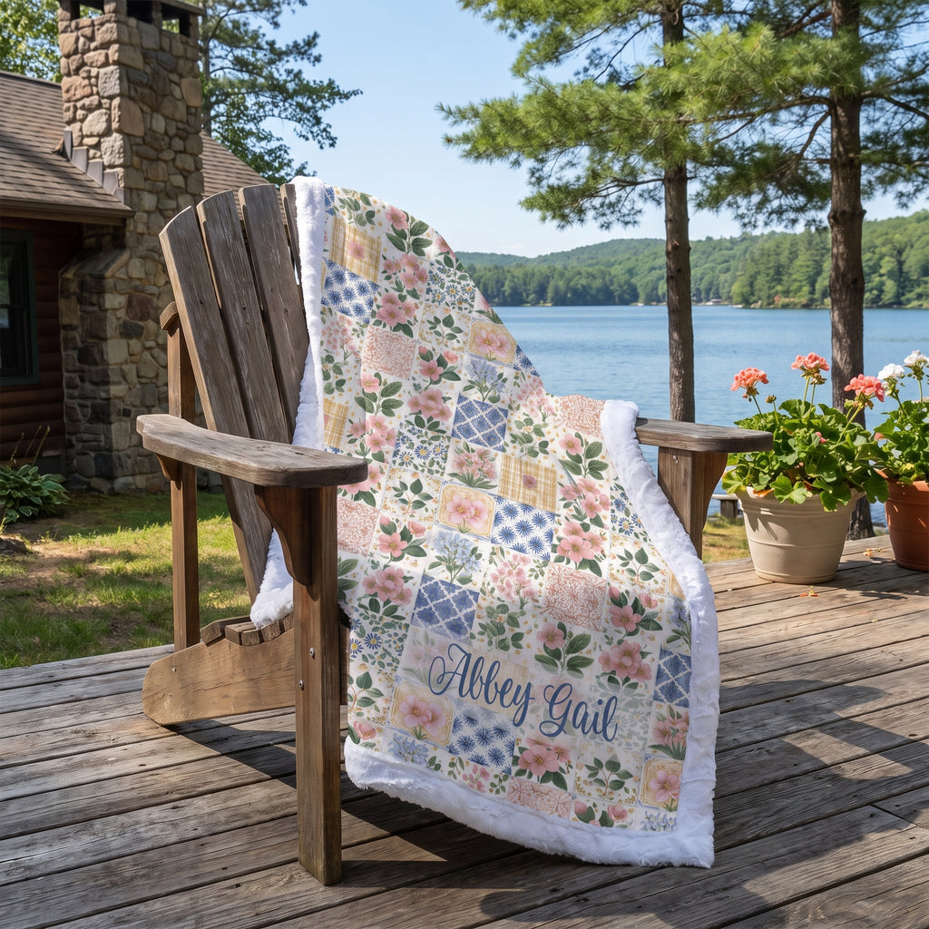 Personalized floral patchwork minky blanket draped over a chair on an outdoor patio