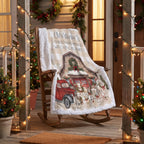 A personalized Christmas-themed fleece blanket draped over a wooden rocking chair on a porch. The blanket features a white and beige gingham border, the text 'Christmas Movie Watching Blanket' with a photo placeholder, and an illustration of a red truck, Santa, and holiday animals.