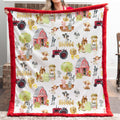 Person holding a blanket with farm-themed pattern featuring animals and tractors.