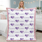 Girl holding purple heart blanket