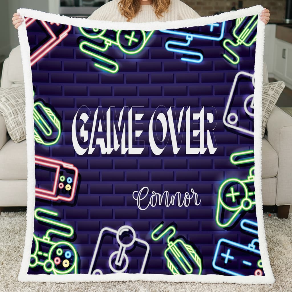 Blanket with 'GAME OVER' and 'Connor' text, neon graphics on a brick wall background.