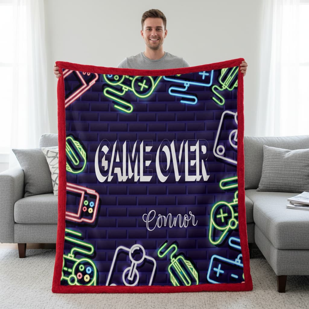 Person holding a blanket with 'Game Over' and neon graphics in a living room setting.