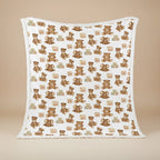 Baby blanket with teddy bear and block pattern on a beige background