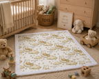 Bear and moon baby blanket with white minky trim flat-laid on floor in cozy nursery