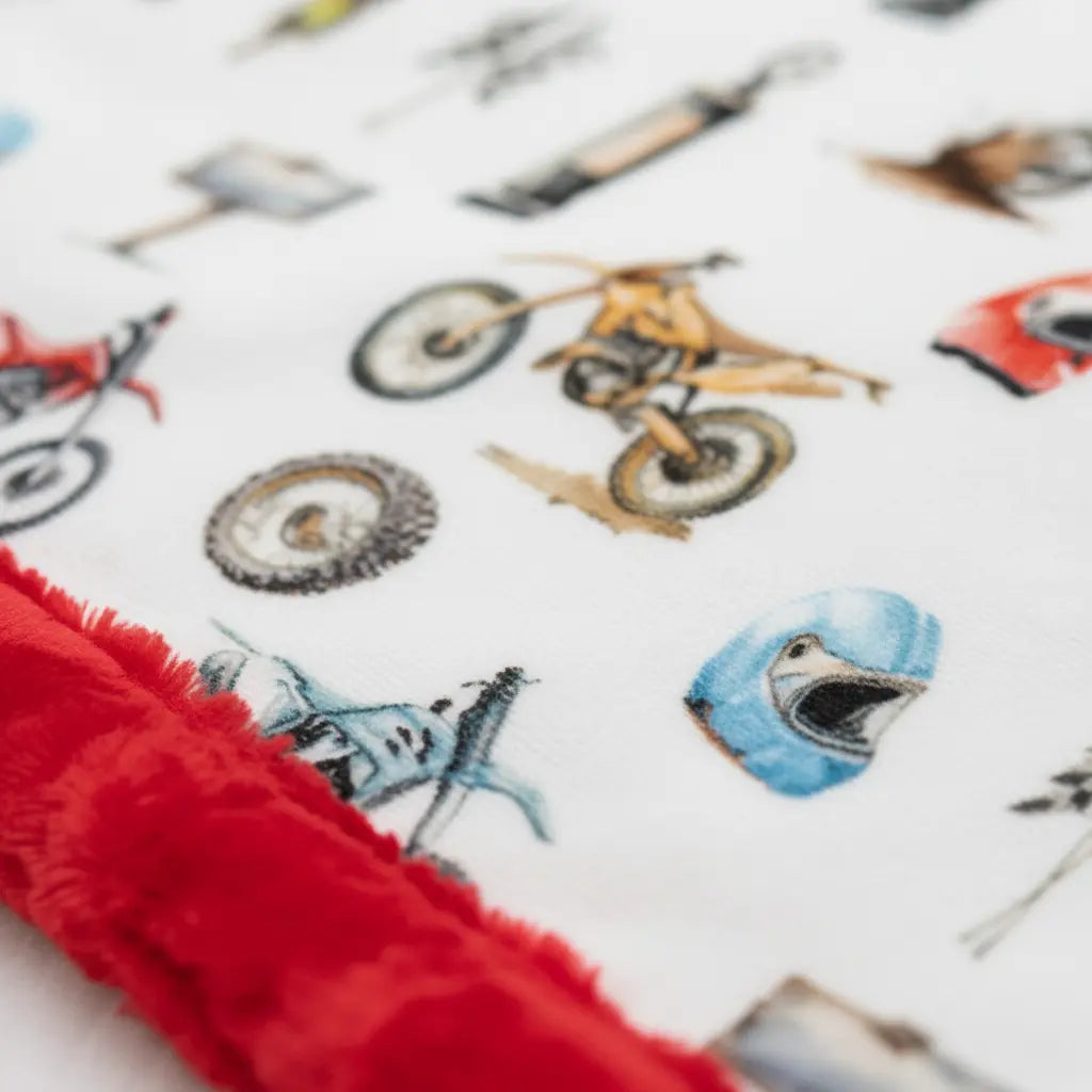 Children's blanket with cartoon characters and red border