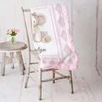 Elephant minky baby blanket draped over rustic chair, rosette fur backing visible