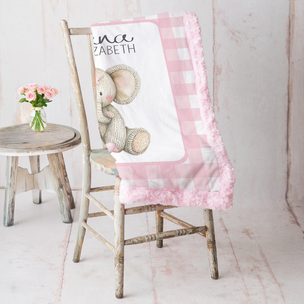 Elephant minky baby blanket draped over rustic chair, pink rosette fur backing