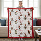 Person holding a blanket with gnome pattern and 'Charlie' text in a living room.