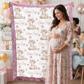 Pregnant woman posing with personalized highland cow blanket at baby shower