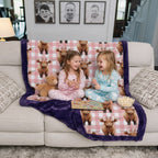 Two children sitting on a couch under a blanket with cow pattern, in a home setting.