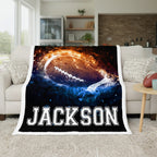Blanket with 'JACKSON' printed on it draped over a couch in a living room.