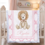 Personalized lion minky baby blanket with white fur trim, hanging on crib in pink nursery