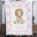 Personalized lion baby blanket with white fur trim, pink floral border, held by fireplace mantel