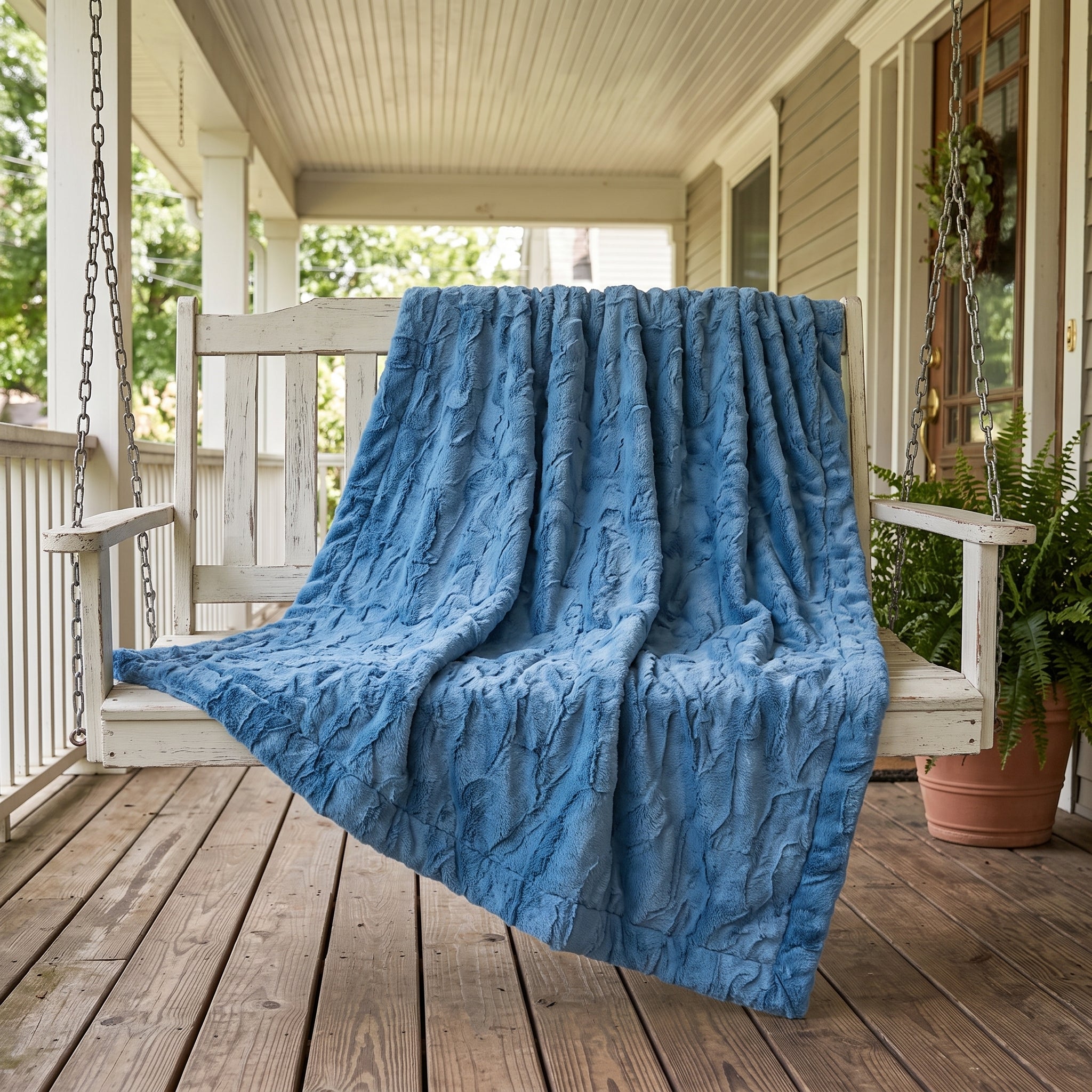 Close-up of soft blue Luxe Cuddle Minky fabric texture on porch swing