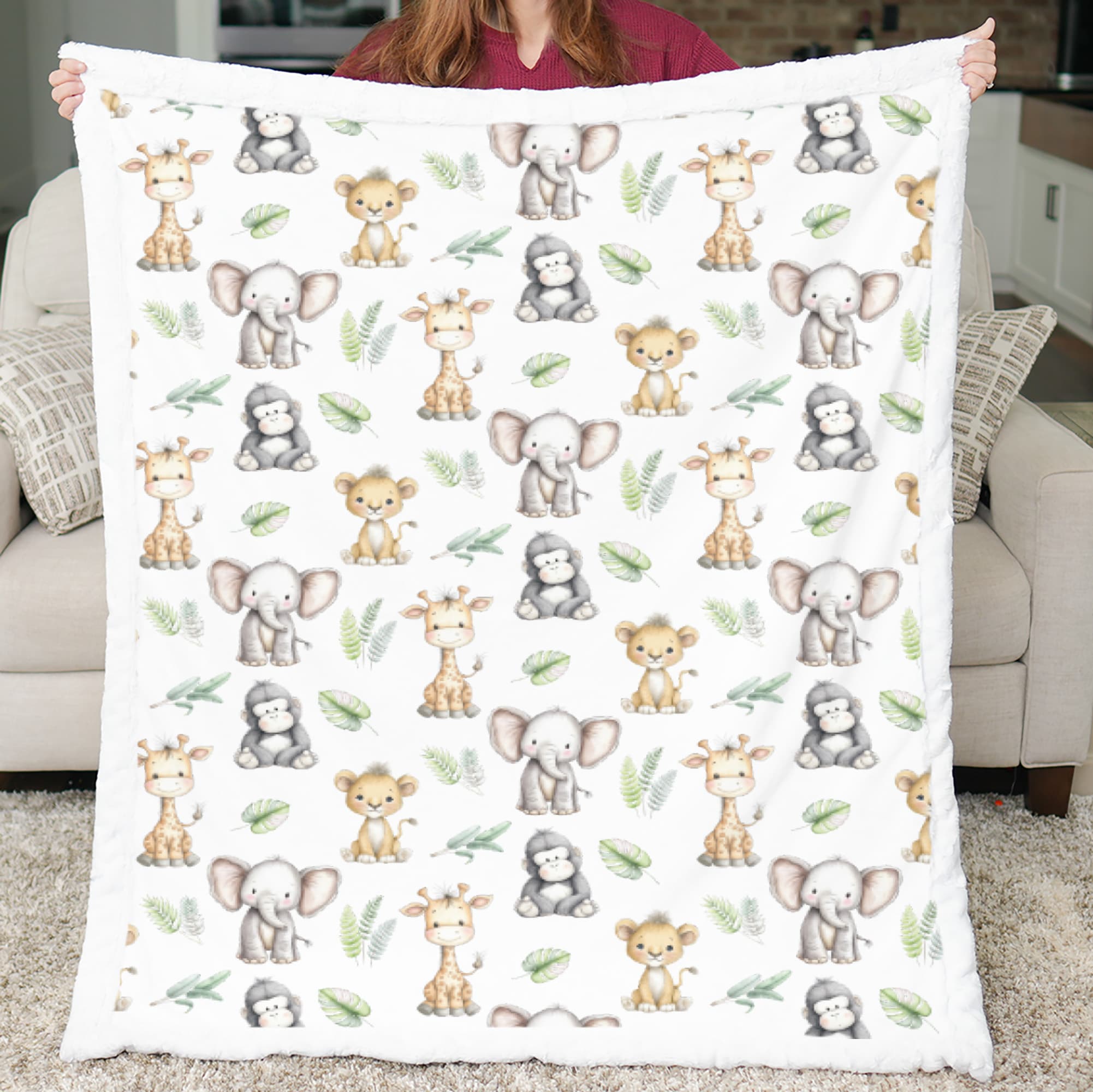 Person holding a blanket with animal pattern in a living room