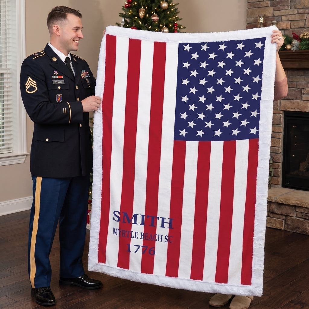 Personalized American flag blanket with family name held by soldier and woman near Christmas tree