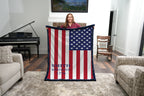 Woman holding personalized American flag minky blanket with navy trim in living room