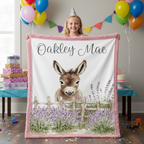 Girl holding personalized baby donkey minky blanket with pink trim at birthday party