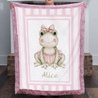 Personalized minky ballerina frog baby blanket with mauve pink fur border by fireplace