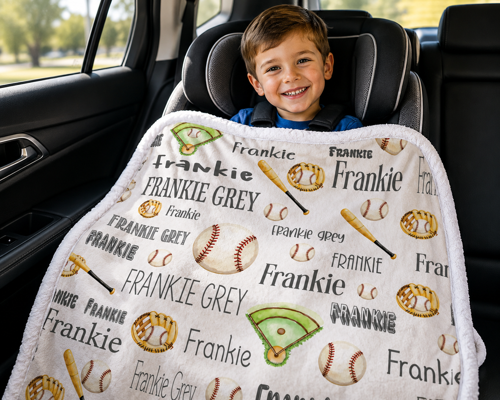 Boy in car seat with personalized baseball blanket with custom name, white faux fur trim
