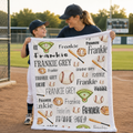 Mother and son holding personalized baseball blanket with custom name on baseball field
