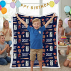 Child standing on a baseball-themed blanket with 'Zachary' printed on it, surrounded by birthday decorations.