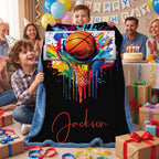 Boy holding personalized basketball Luxe Cuddle blanket at birthday party with family and balloons