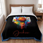 Personalized basketball Luxe Cuddle blanket on bed full view, blue border and colorful hoop art on black