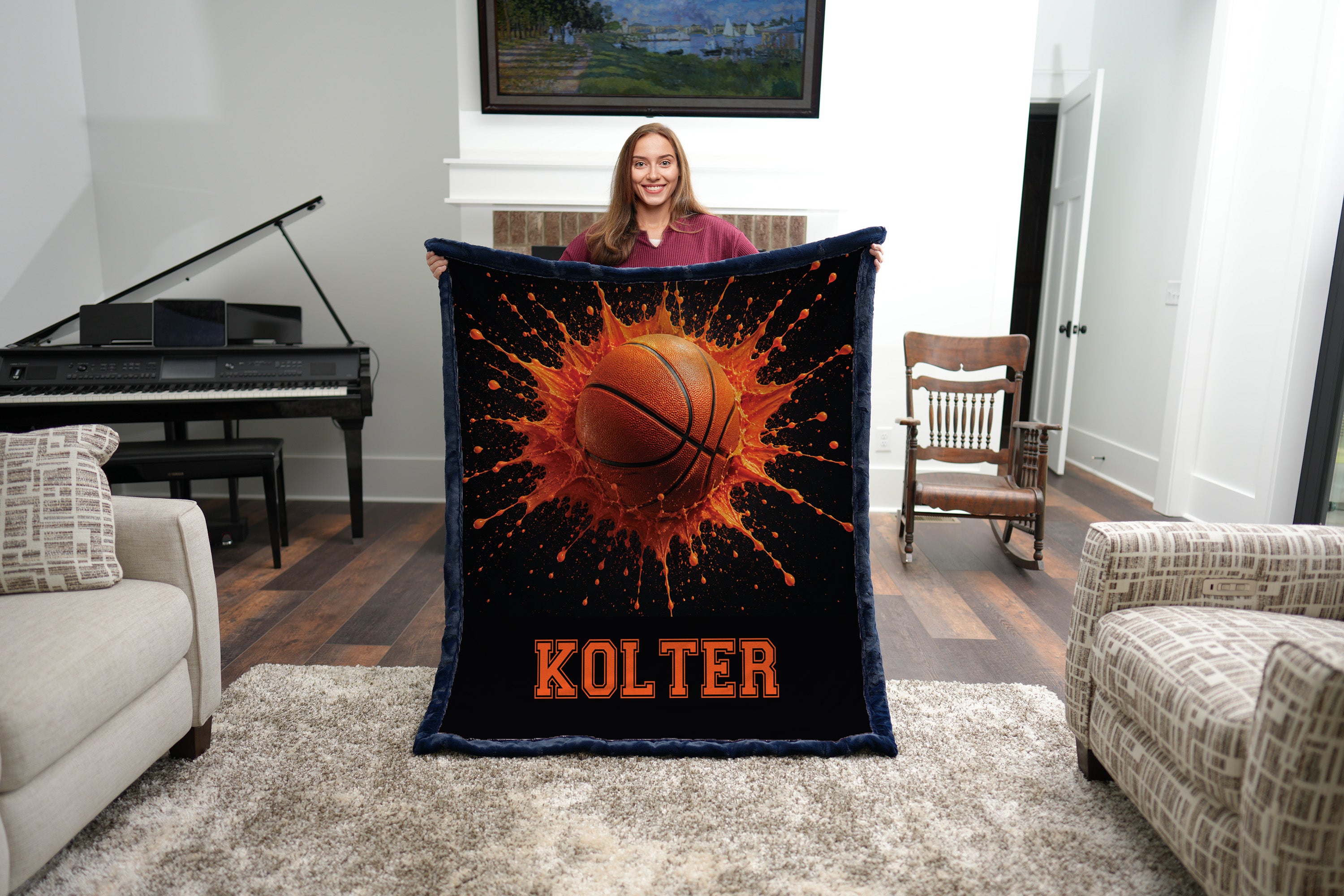 Personalized basketball minky blanket with navy trim and custom name, held by a woman
