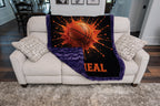Personalized basketball minky blanket with purple minky back, folded over a couch