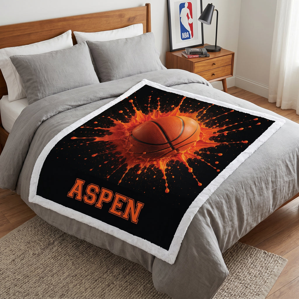 Personalized basketball minky blanket with white trim and custom name, laid on a bed