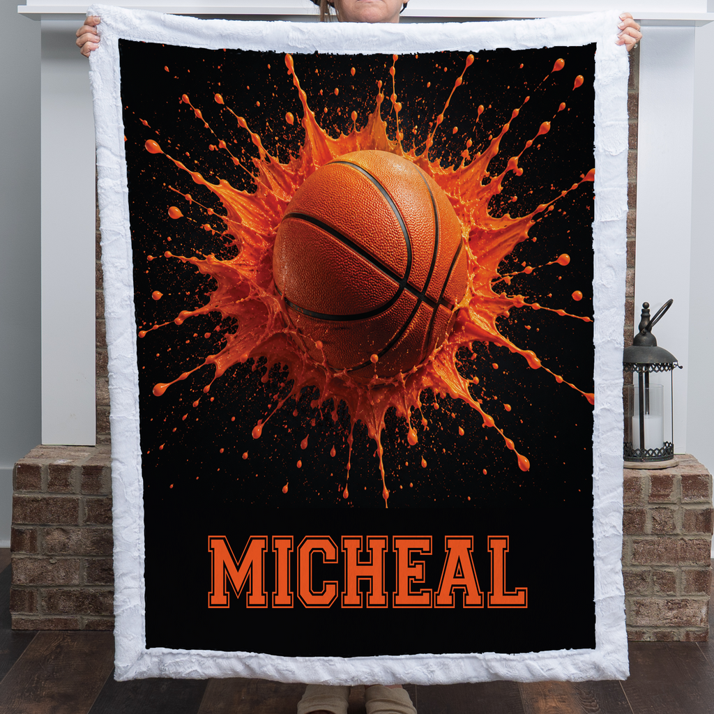 Personalized basketball minky blanket with white trim and custom name, by a brick fireplace