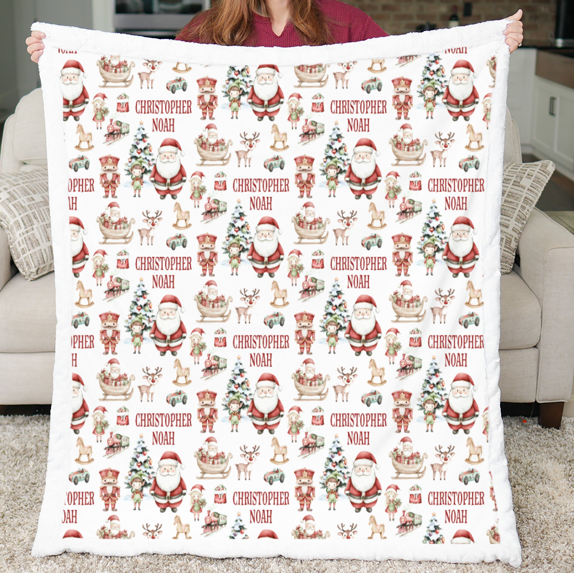 Personalized Christmas minky blanket with Santa print held up showing white sherpa back
