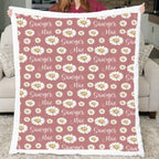 Woman holding personalized daisy minky blanket with white sherpa back