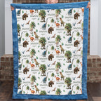 Personalized dinosaur minky baby blanket with custom name, held up by a boy, blue trim