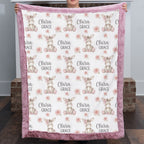 Personalized minky donkey baby blanket with mauve pink fur border held up by fireplace