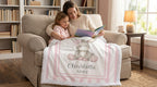 Mother and daughter reading together with personalized minky donkey baby blanket