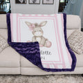Personalized minky donkey baby blanket with purple minky back draped over couch