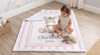 Toddler playing with donkey plush toy on personalized minky baby blanket
