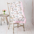 Personalized minky donkey baby blanket with pink rosette fur border on vintage chair