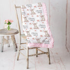 Personalized minky donkey baby blanket with pink rosette fur border on vintage chair