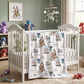 Personalized dragon castle blanket with blue trim draped over white nursery crib