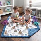 Children playing with dragon toys on personalized dragon castle blanket, blue trim