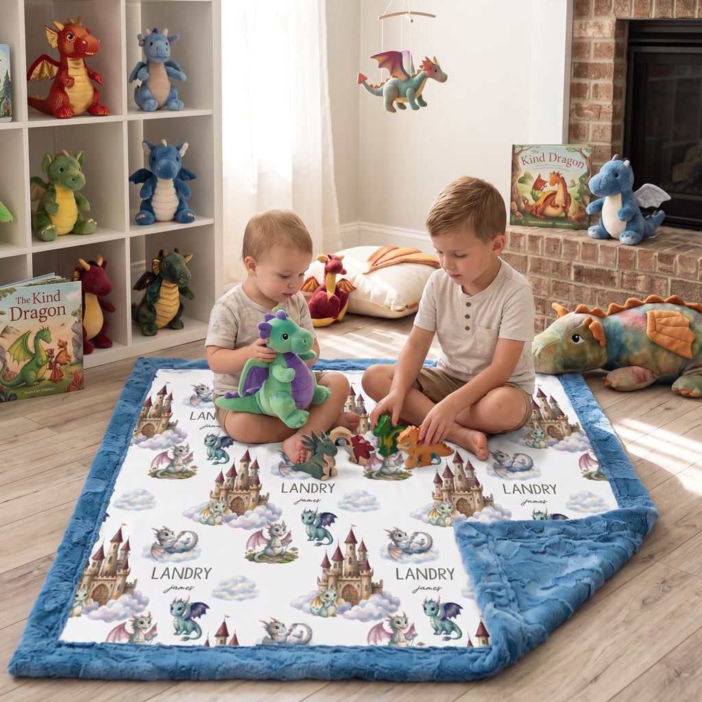 Children playing on personalized dragon castle blanket with blue trim